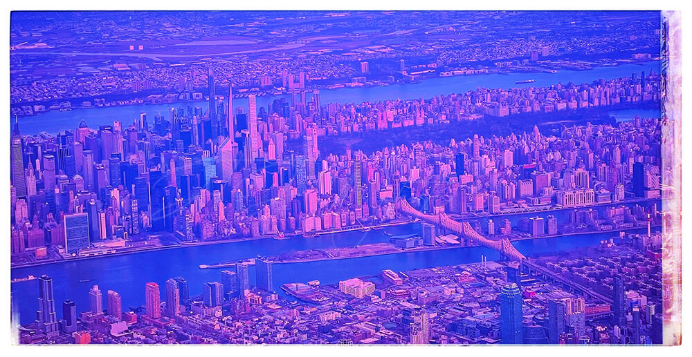 A photograph of an arial view of Manhattan titled 'Window Seat Worthy', from the City Slick collection of JTJ' White's City Series photography album. This image is edited to give off a purple-orange surreal hue effect
